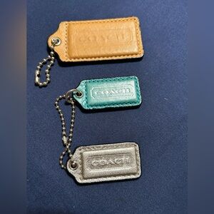 Coach tags 3 leather tags tan, blue and silver.  2 chains